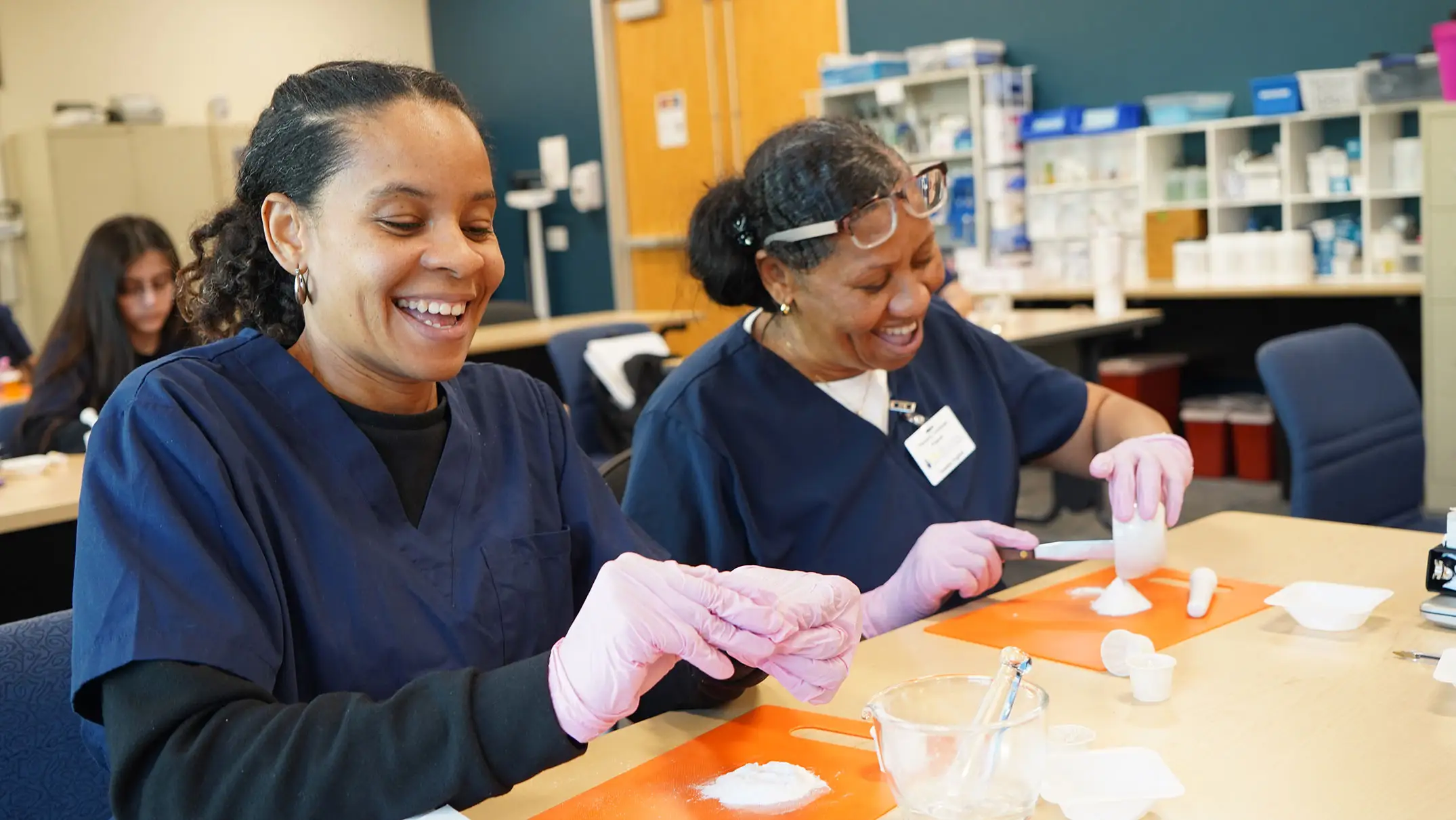 Two medical students doing an experiment in class