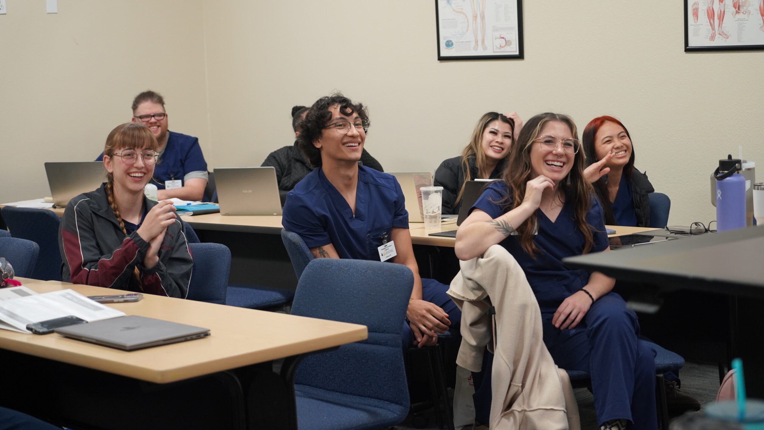 Students in phlebotomy training in San Bernardino smiling during class at a CALRegional partner school.