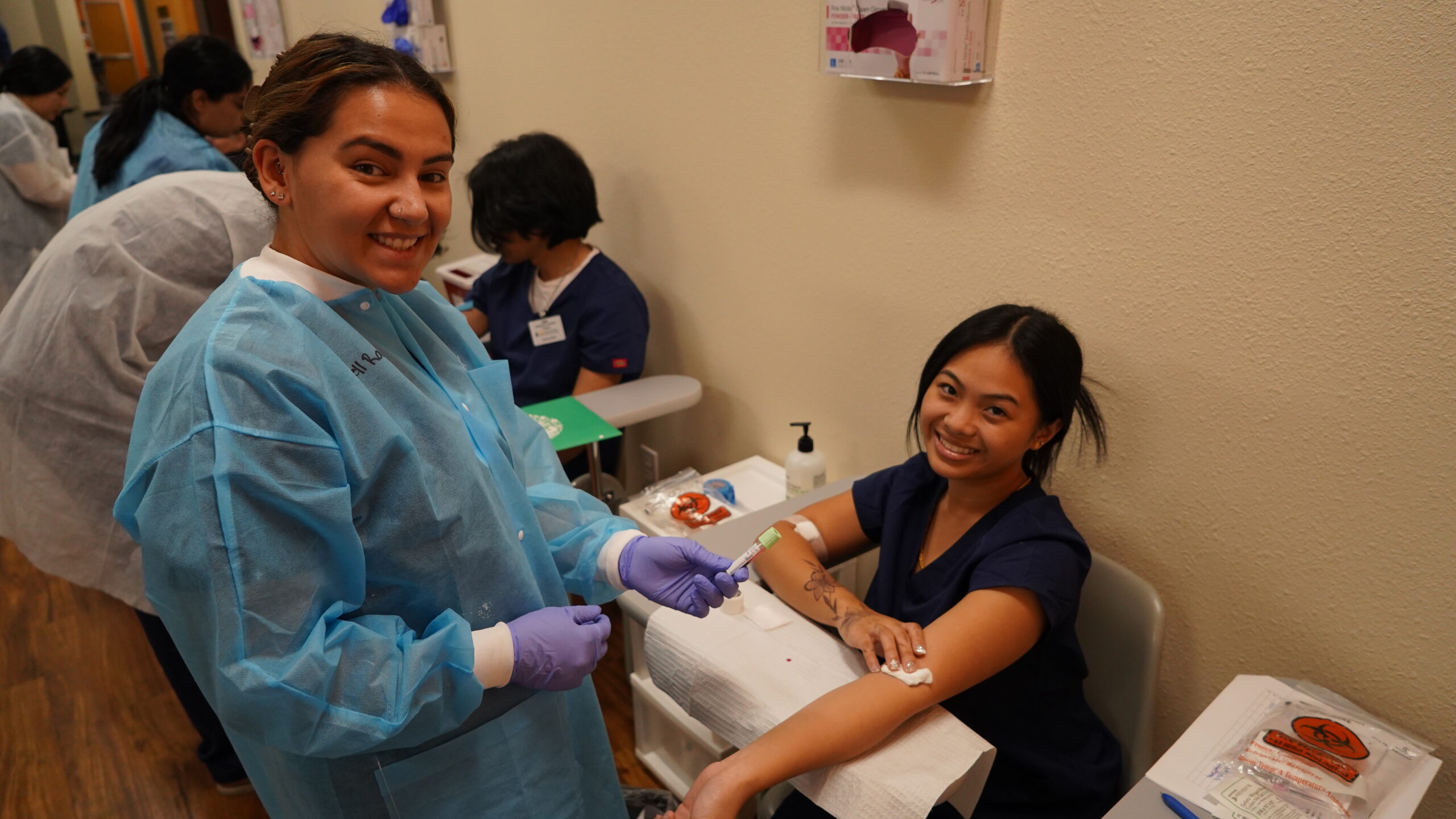 Student practicing venipuncture during hands-on phlebotomy training at a CALRegional partner program near San Bernardino.