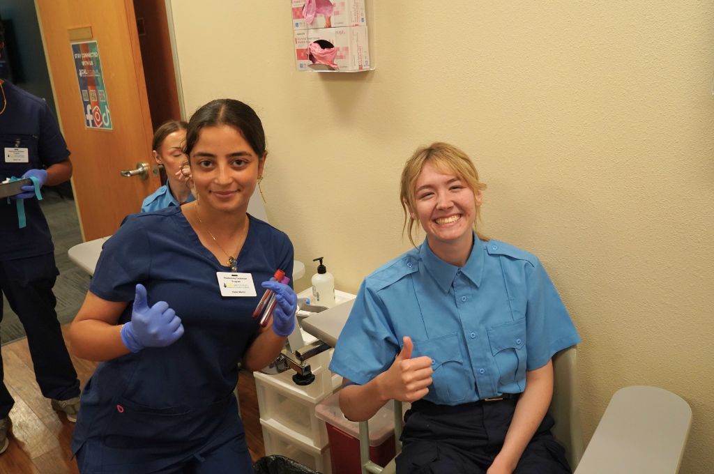 Beaumont Adult School phlebotomy students giving thumbs up after completing certification prep and venipuncture practice.