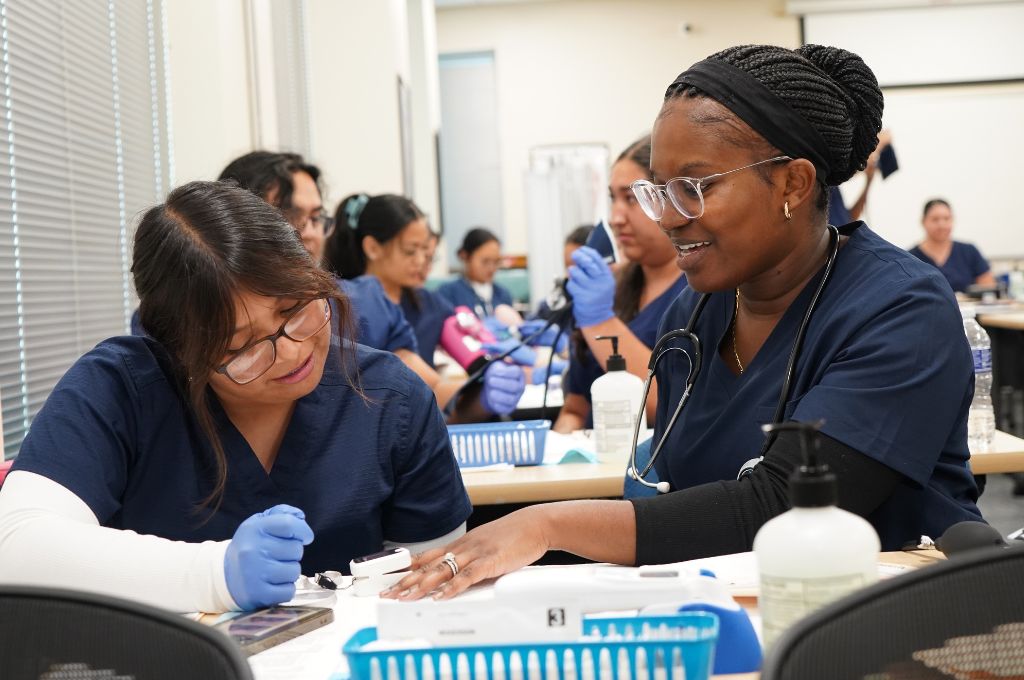 Medical assistant students in San Jose practicing clinical skills during class at East Side Adult Education.